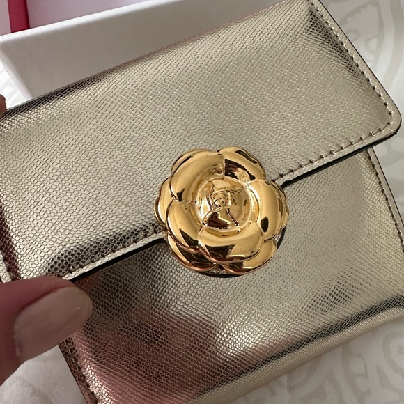 Gold leather Oscar de la Renta wallet and coin purse.